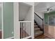 View of the staircase and storage area, located off the living room at 914 Woodbridge Ct, Safety Harbor, FL 34695