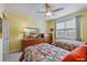 Bedroom featuring two beds, carpet flooring, a ceiling fan and natural light at 960 Starkey Rd # 5406, Largo, FL 33771