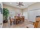 Dining room is bright and spacious with wood floors, a ceiling fan, and large windows at 960 Starkey Rd # 5406, Largo, FL 33771