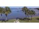 Lush backyard with palm trees and picnic area overlooking the bay at 100 Bluff View Dr # 417A, Belleair Bluffs, FL 33770