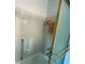 Tiled bathroom featuring a shower and tub with gold trim and accessories at 100 Bluff View Dr # 417A, Belleair Bluffs, FL 33770