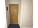 Charming apartment front door with brick and an American flag detail at 100 Bluff View Dr # 417A, Belleair Bluffs, FL 33770