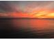Beautiful sunset view over the water showcasing vibrant orange and yellow colors at 100 Bluff View Dr # 417A, Belleair Bluffs, FL 33770