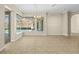 Bright dining area boasts tile flooring and pool views through the large windows at 10561 Greencrest Dr, Tampa, FL 33626