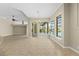 Open dining area with large windows and a view of the pool at 10561 Greencrest Dr, Tampa, FL 33626