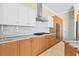 Gourmet kitchen with stainless steel appliances, granite countertops, and stylish white backsplash at 10561 Greencrest Dr, Tampa, FL 33626