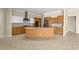 Spacious kitchen with stainless steel appliances, granite countertops, and wood cabinets at 10561 Greencrest Dr, Tampa, FL 33626
