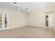Open living room featuring tile floors, recessed lighting, and access to other rooms through multiple entryways at 10561 Greencrest Dr, Tampa, FL 33626