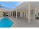 Open lanai with barbecue area overlooking the pool with beautiful blue water at 10561 Greencrest Dr, Tampa, FL 33626