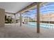 Screened pool with spa, tile patio, and lovely view of the lake at 10561 Greencrest Dr, Tampa, FL 33626