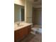 Bathroom features a wide mirror, modern vanity, bathtub, and shower with neutral-toned tile at 1208 E Kennedy Blvd # 1022, Tampa, FL 33602