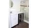 Modern bathroom with a vanity, a wine fridge, and glass shower at 1208 E Kennedy Blvd # 1022, Tampa, FL 33602