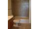 Bathroom featuring modern vanity, toilet, and shower-tub with neutral-toned tile at 1208 E Kennedy Blvd # 1022, Tampa, FL 33602