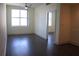 Bright bedroom with a ceiling fan, large window, and wood-style flooring at 1208 E Kennedy Blvd # 1022, Tampa, FL 33602