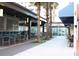 Outdoor seating and dining area with lots of palm trees at 1208 E Kennedy Blvd # 1022, Tampa, FL 33602