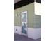 The pale green exterior features a metal finish, complemented by a sleek door at 1208 E Kennedy Blvd # 1022, Tampa, FL 33602