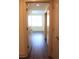 Hallway showcases seamless transition into a naturally bright bedroom with stylish flooring at 1208 E Kennedy Blvd # 1022, Tampa, FL 33602