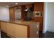 The kitchen is equipped with stainless steel appliances, granite countertops, and wooden cabinets at 1208 E Kennedy Blvd # 1022, Tampa, FL 33602
