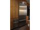 Close-up of the chef-inspired Viking stainless steel refrigerator and built-in oven at 1208 E Kennedy Blvd # 1022, Tampa, FL 33602