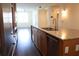 Open kitchen featuring a large island, stainless appliances, and dark hardwood floors at 1208 E Kennedy Blvd # 1022, Tampa, FL 33602