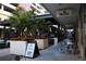 Outdoor seating and dining area with lots of palm trees at 1208 E Kennedy Blvd # 1022, Tampa, FL 33602