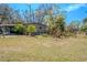 Wide backyard with lush greenery and garden space, perfect for outdoor enjoyment at 12303 Greenland Dr, Riverview, FL 33579