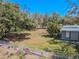 Fenced backyard with garden and accessory building, offering privacy and space at 12303 Greenland Dr, Riverview, FL 33579
