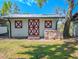 Quaint barn with red and white trim, and a pile of bricks outside at 12303 Greenland Dr, Riverview, FL 33579