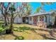 Exterior view of a barn with double doors and lush green surroundings at 12303 Greenland Dr, Riverview, FL 33579