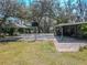 Features of outdoor sports area with basketball court and covered patio at 12303 Greenland Dr, Riverview, FL 33579