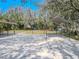 Features of outdoor sports area with basketball court and shaded seating at 12303 Greenland Dr, Riverview, FL 33579