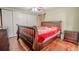 Bedroom with a large bed, a window, and wood floors at 12303 Greenland Dr, Riverview, FL 33579