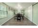 Elegant dining room features a stylish chandelier and sliding barn door at 12303 Greenland Dr, Riverview, FL 33579