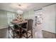 Dining room with a view of the bright kitchen through a sliding barn door at 12303 Greenland Dr, Riverview, FL 33579