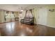 Bright living room featuring hardwood floors, ceiling fan and large windows at 12303 Greenland Dr, Riverview, FL 33579