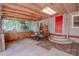 Outdoor kitchen and dining area under a covered patio, perfect for entertaining at 12303 Greenland Dr, Riverview, FL 33579