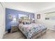 Bright bedroom with stylish decor, wood floors, and a large window at 1489 Dundee Dr, Palm Harbor, FL 34684