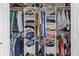Organized closet with shelves and hanging rods for clothing and accessories at 1489 Dundee Dr, Palm Harbor, FL 34684