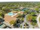 An aerial view of a community center and a swimming pool at 1489 Dundee Dr, Palm Harbor, FL 34684