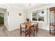 Dining room featuring wood table and chairs and large window for natural light at 1489 Dundee Dr, Palm Harbor, FL 34684