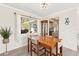 Cozy dining room featuring a wood table, chairs, and a view into the kitchen at 1489 Dundee Dr, Palm Harbor, FL 34684