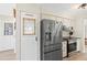 Modern kitchen with stainless steel appliances and a unique pantry door at 1489 Dundee Dr, Palm Harbor, FL 34684