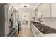 Modern kitchen with stainless steel appliances, granite countertops, and stylish backsplash at 1489 Dundee Dr, Palm Harbor, FL 34684