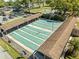A shuffleboard court offers a recreational area with shaded seating for residents at 1489 Dundee Dr, Palm Harbor, FL 34684