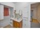 Simple bathroom with a vanity, an oval mirror, and built in storage at 15 Shore Dr, Palm Harbor, FL 34683