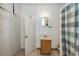 Standard bathroom including a shower and built-in cabinet, and a single vanity at 15 Shore Dr, Palm Harbor, FL 34683