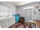 Compact kitchen with a blue oven, vintage sink, and traditional decor at 15 Shore Dr, Palm Harbor, FL 34683