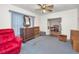 Relaxing living room with a comfortable red chair and vintage-style furniture at 15 Shore Dr, Palm Harbor, FL 34683