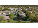 An aerial view of a community with ponds and beautiful green landscaping and covered parking at 1601 43Rd N St # 226, St Petersburg, FL 33713