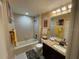 Bathroom with a tub, shower, and granite countertop at 1601 43Rd N St # 226, St Petersburg, FL 33713